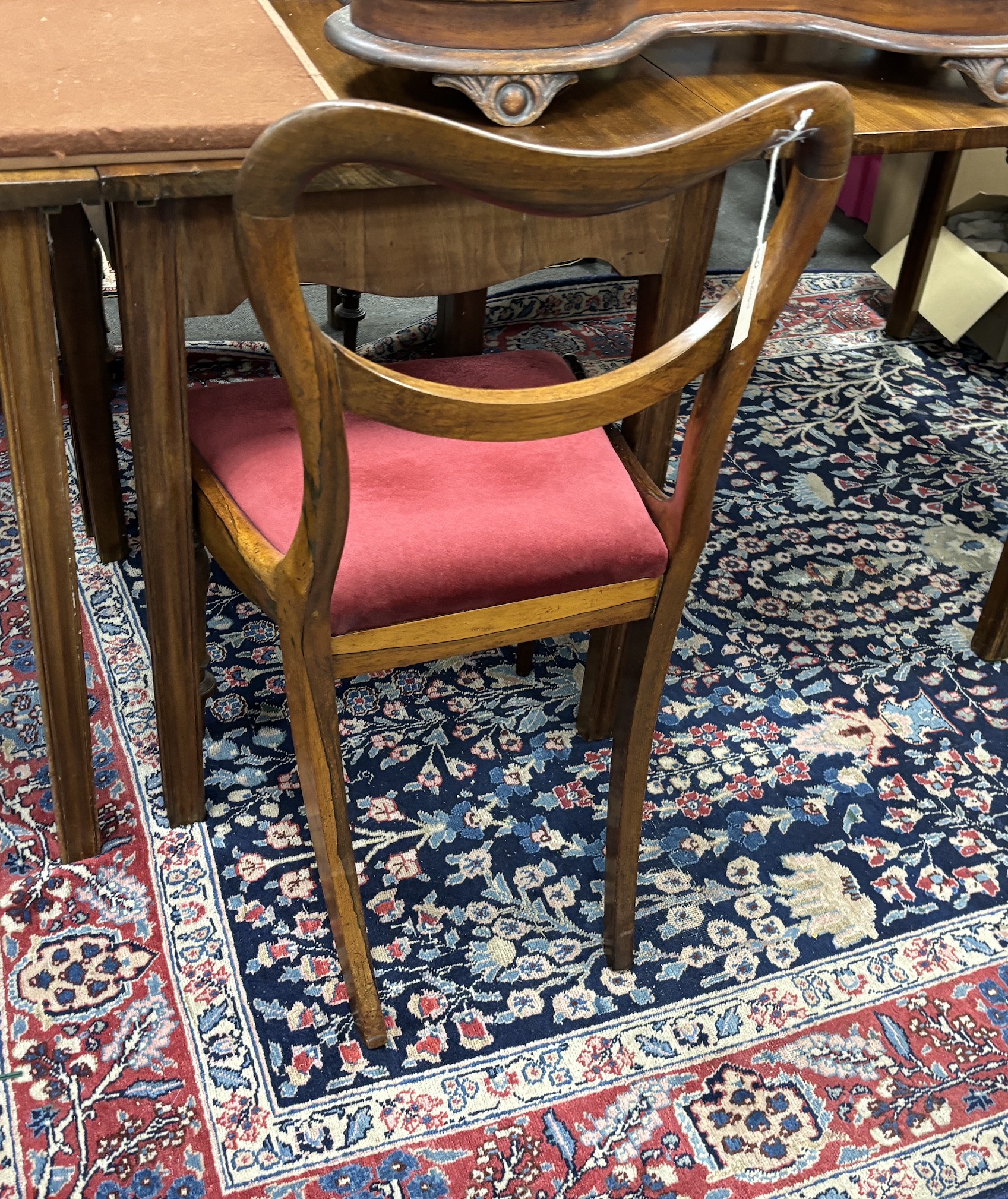 A set of six early Victorian rosewood dining chairs, two with arms